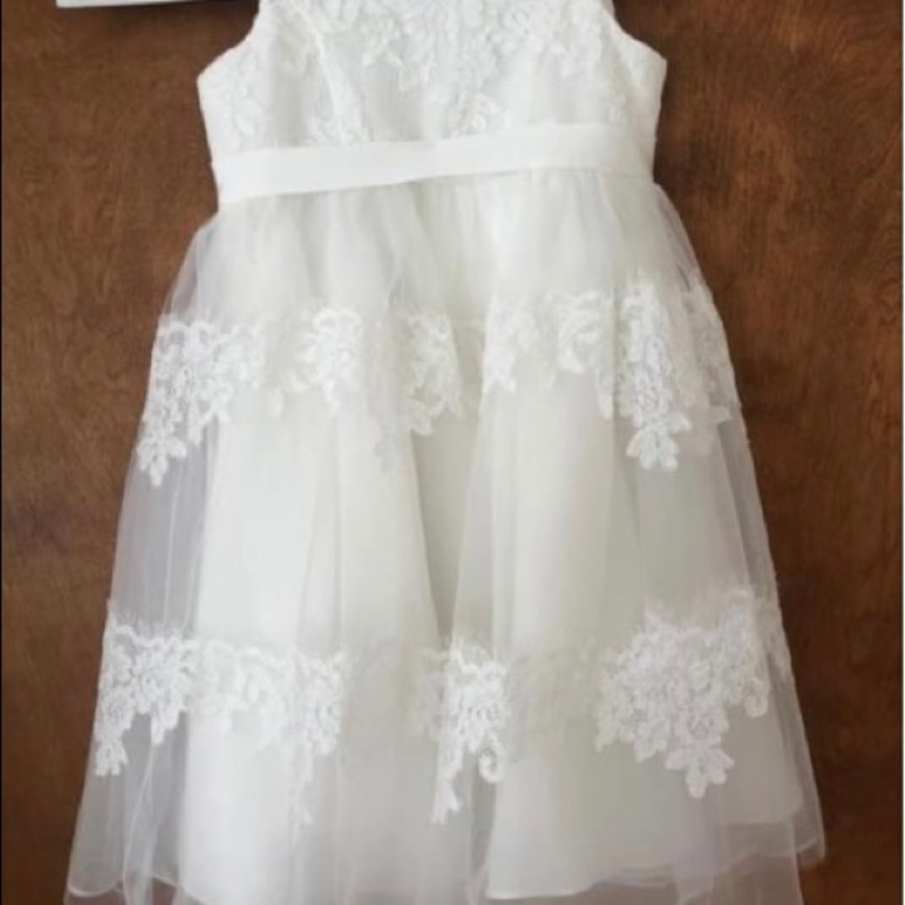 Size 2T David’s Bridal ivory flower girl dress.